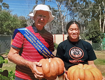 Reginald and Olivia with the prize pumpkin