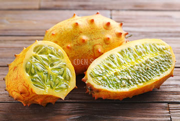 cucumber african horned kiwano cut open on table